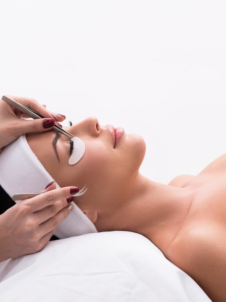 A guest resting, eyes closed, during a lash treatment at RISE